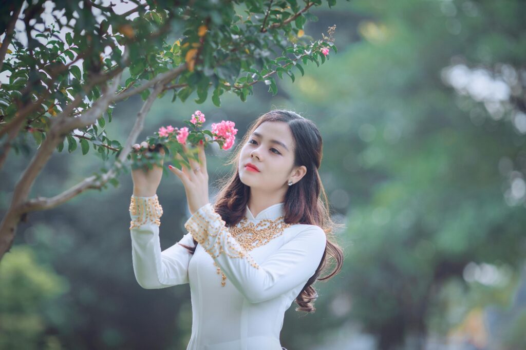 Woman Holding Pink Petaled Flower