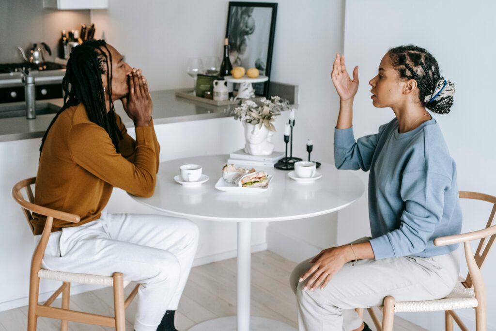 Black couple having conflict in kitchen